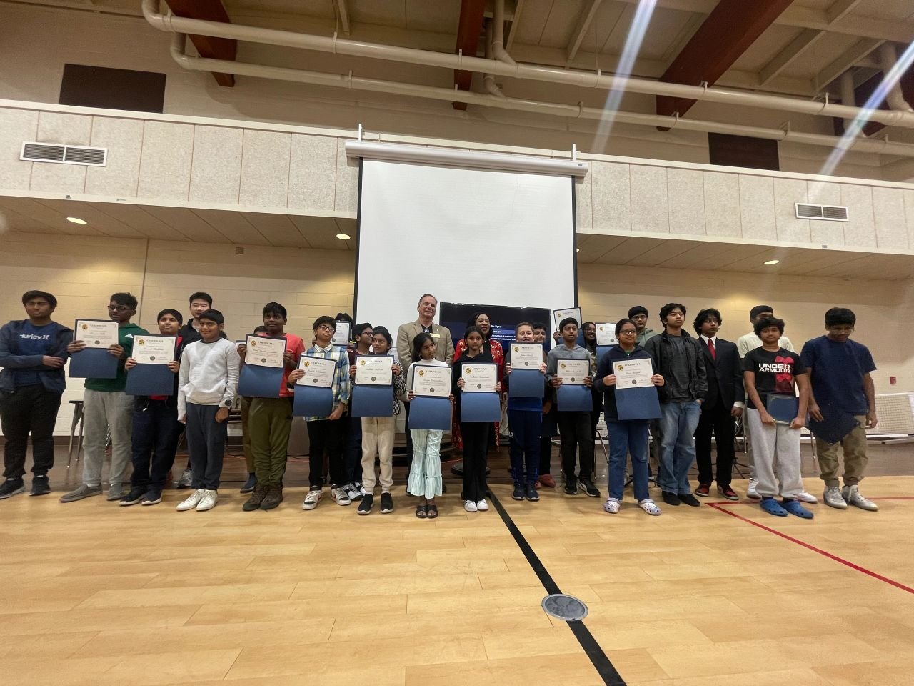 Youth Tech Academy students holding certificates